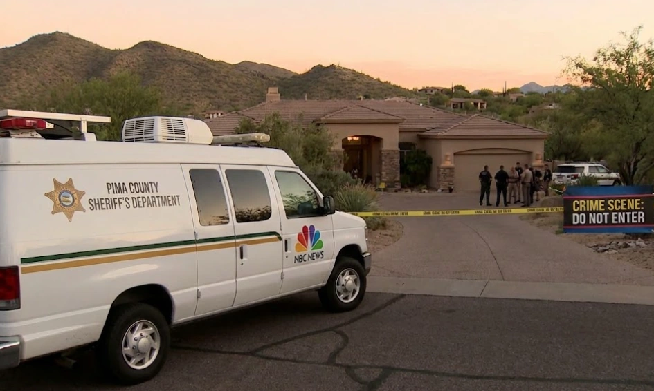 A Pima County Sheriff's Department van is parked outside Nancy Guthrie's Tucson home, which has been declared a crime scene. Investigators are on site as the missing person case evolves into a criminal investigation.