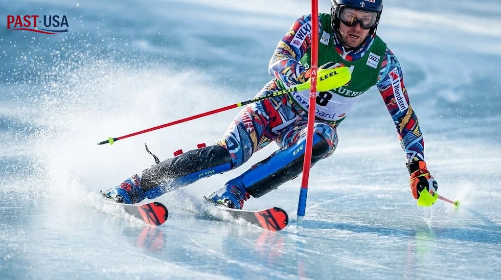 A slalom skier attacks a gate on the unforgiving, "bulletproof" ice of the Olympic course, highlighting the extreme technical difficulty of the final events.